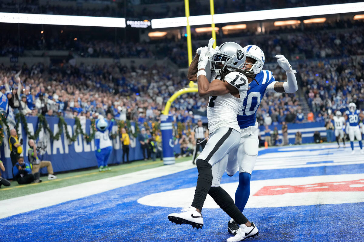 Las Vegas Raiders wide receiver Davante Adams (17) makes a touchdown catch past Indianapolis Co ...