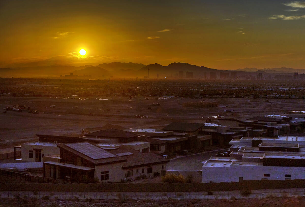 The sun rises over the valley and Strip on another high temperature day on Thursday, July 20, 2 ...