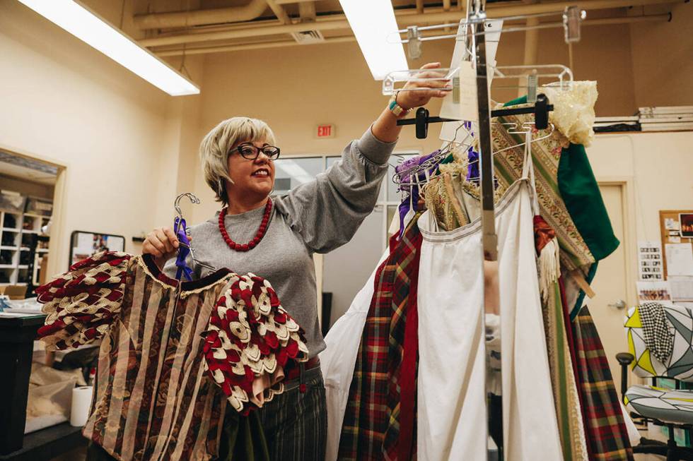 Nevada Ballet Theatre wardrobe coordinator Amanda Williams hangs up wardrobe pieces for the Nut ...