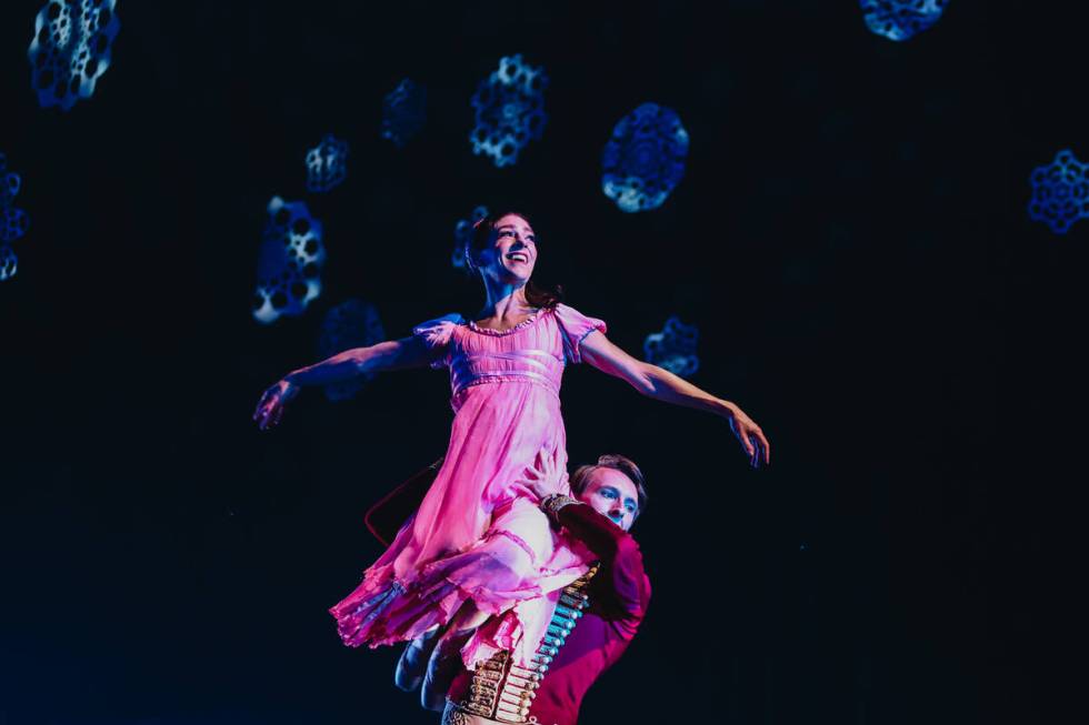 Betsy Lucas, top, performs as Clara as Robert Fulton, the nutcracker, lifts her during a dress ...