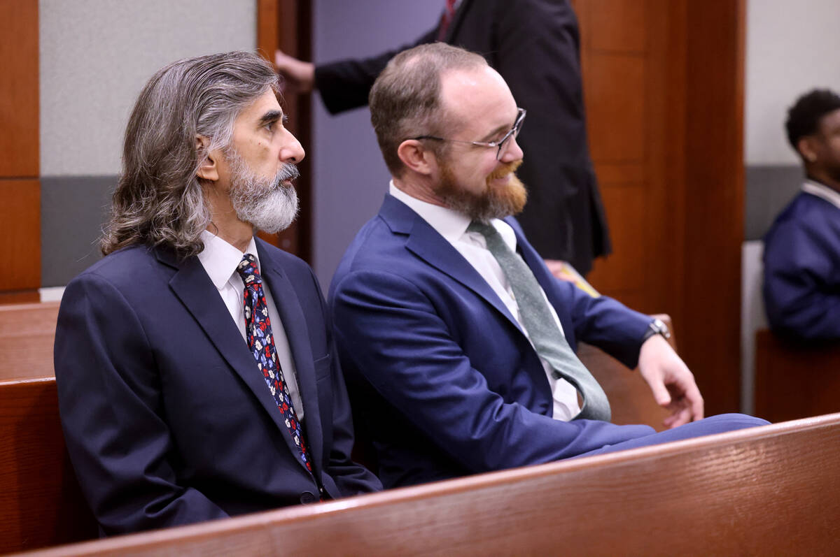 Aramis Bacallao, left, an English language arts teacher at Becker Middle School, waits to appea ...