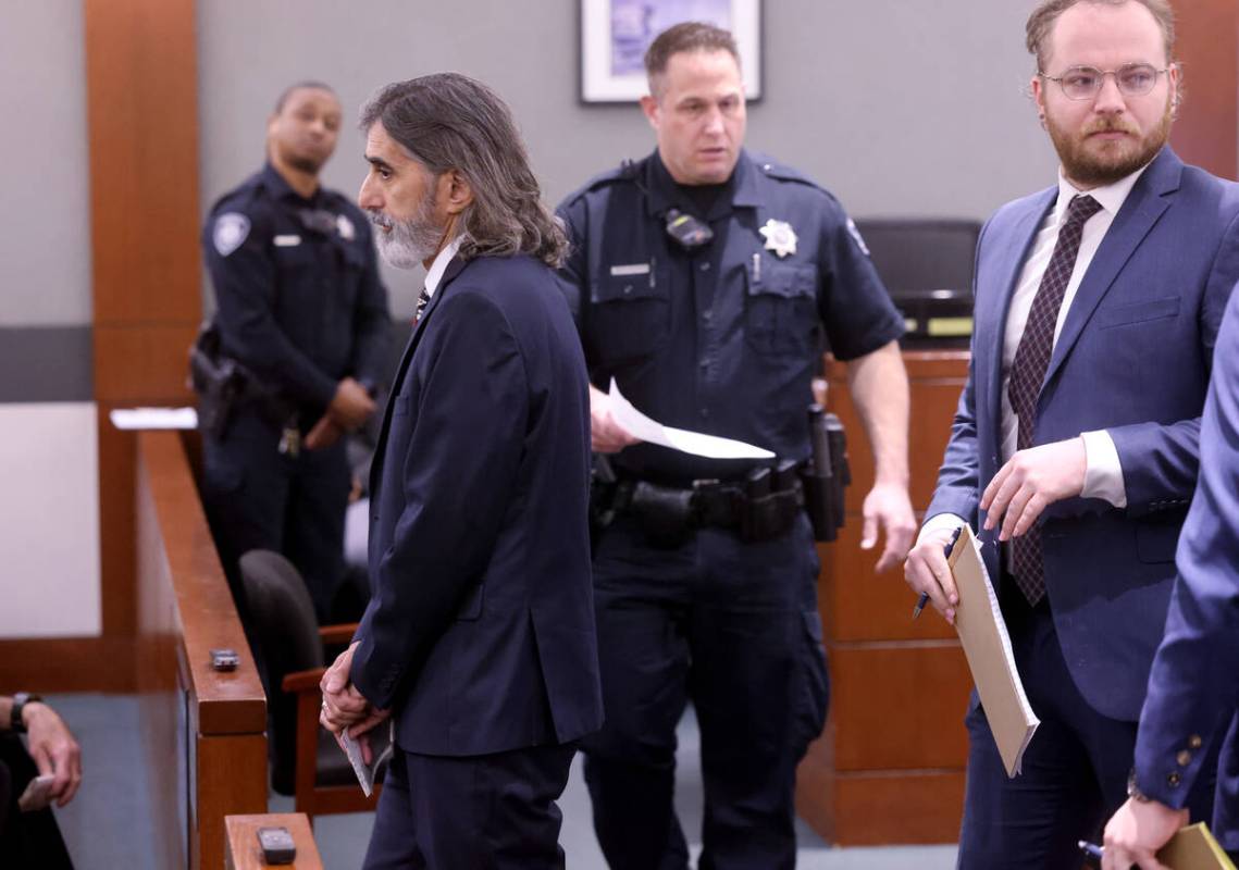 Aramis Bacallao, an English language arts teacher at Becker Middle School, walks out after appe ...