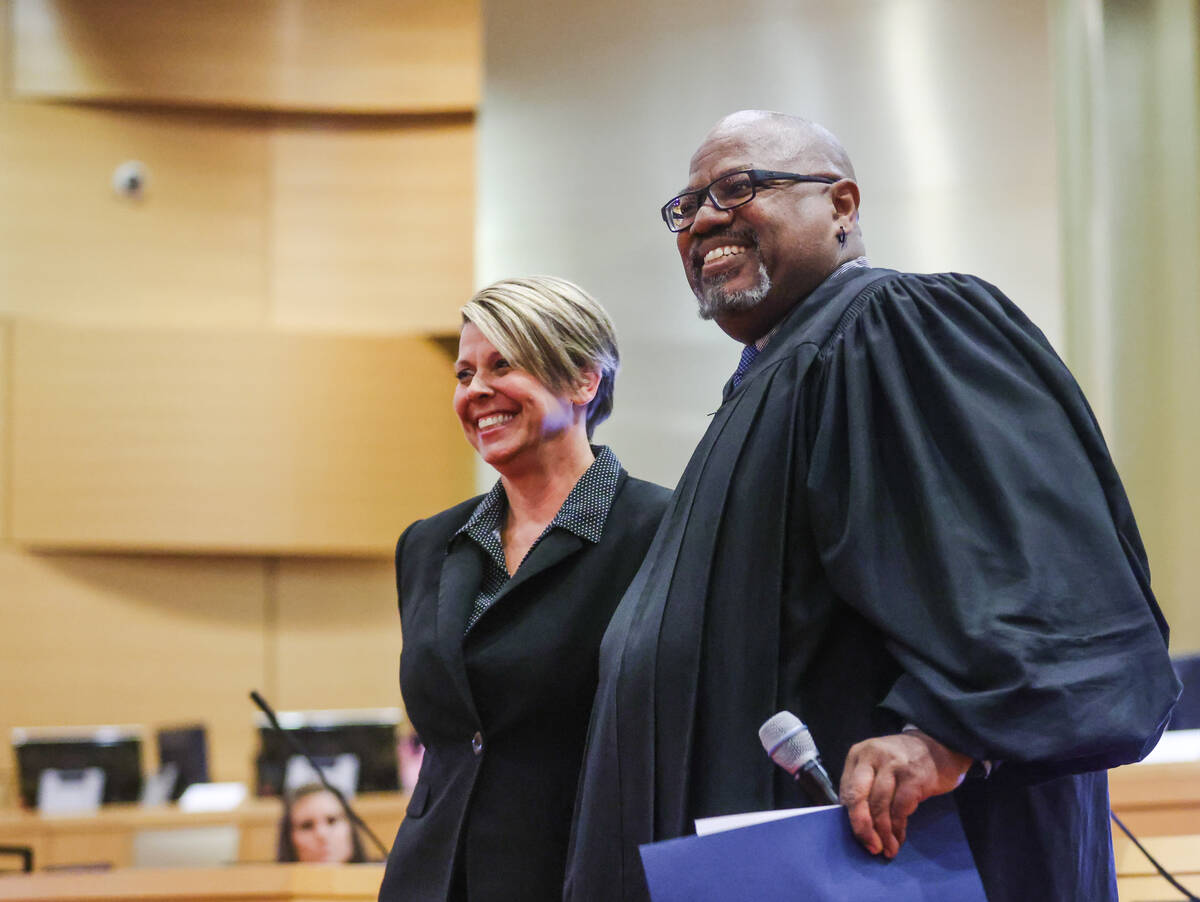 Lisa Satory, a former charter school principal, poses for a photo with District Court Judge Ric ...