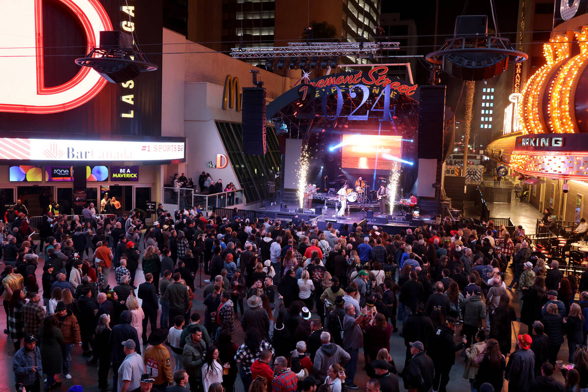 New Year’s Eve revelers watch Beach Weather on the 3rd Street Stage during the Time of Y ...