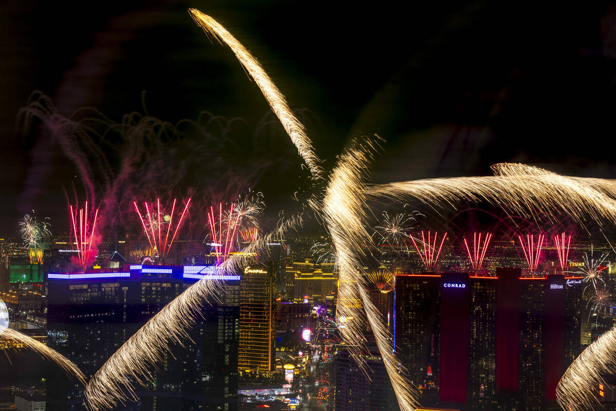 Fireworks erupt over the Las Vegas Strip as part of New Years Eve festivities across the city f ...