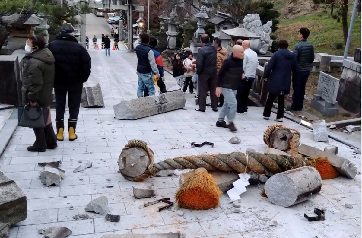 A torii gate is damaged after an earthquake at a shrine in Kanazawa, Ishikawa prefecture, Japan ...