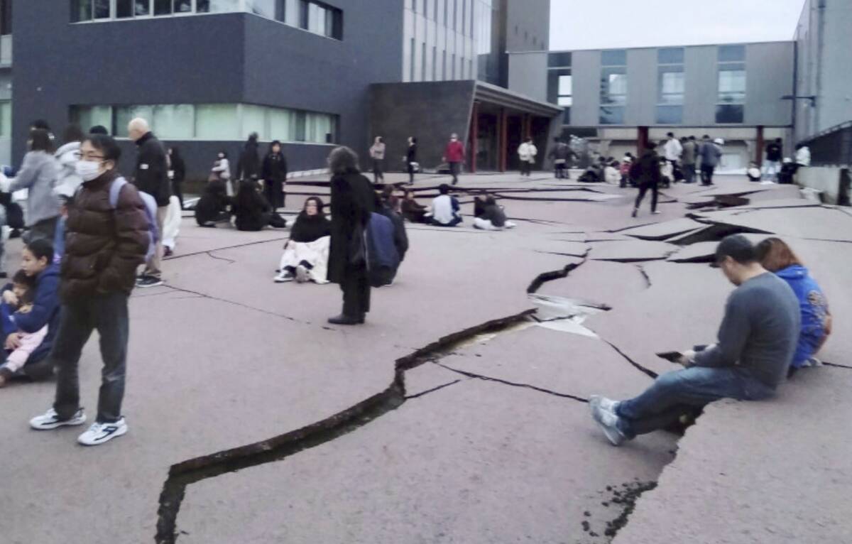 Cracks are seen on the ground in Wajima, Ishikawa prefecture, Japan Monday, Jan. 1, 2024, follo ...