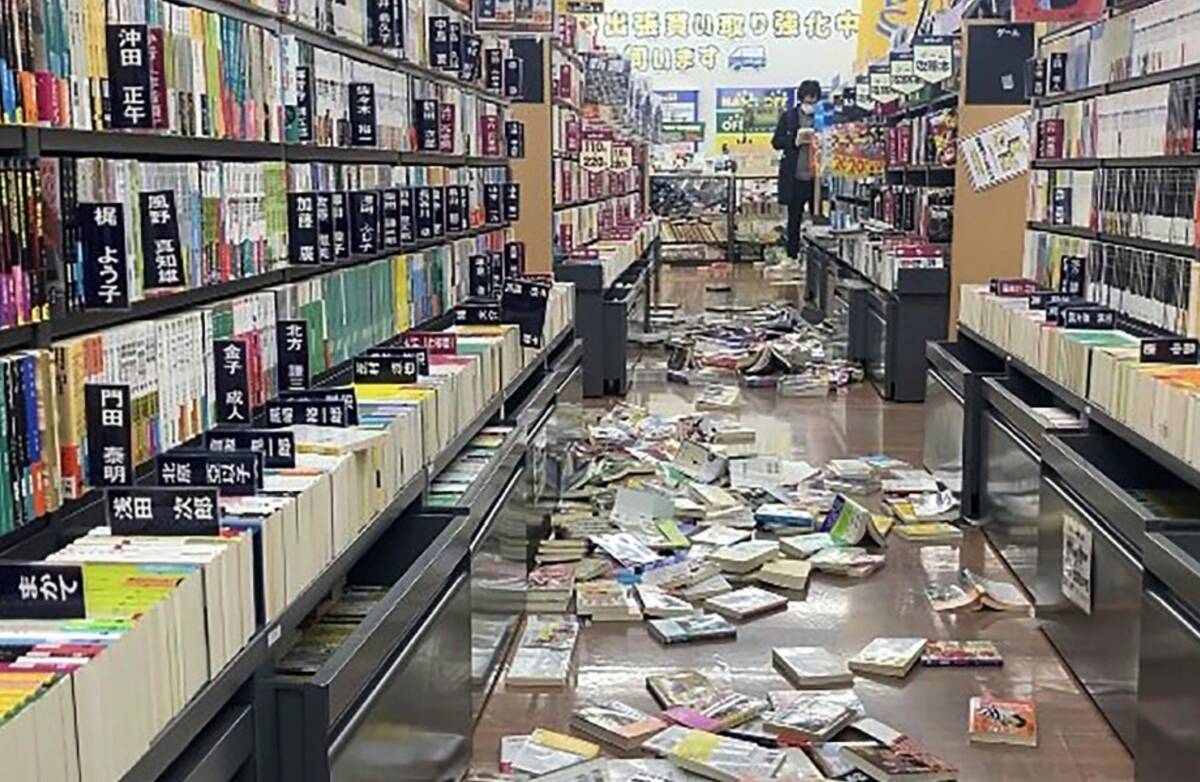 Books are scattered at a bookstore in Niigata, Japan following an earthquake Monday, Jan. 1, 20 ...