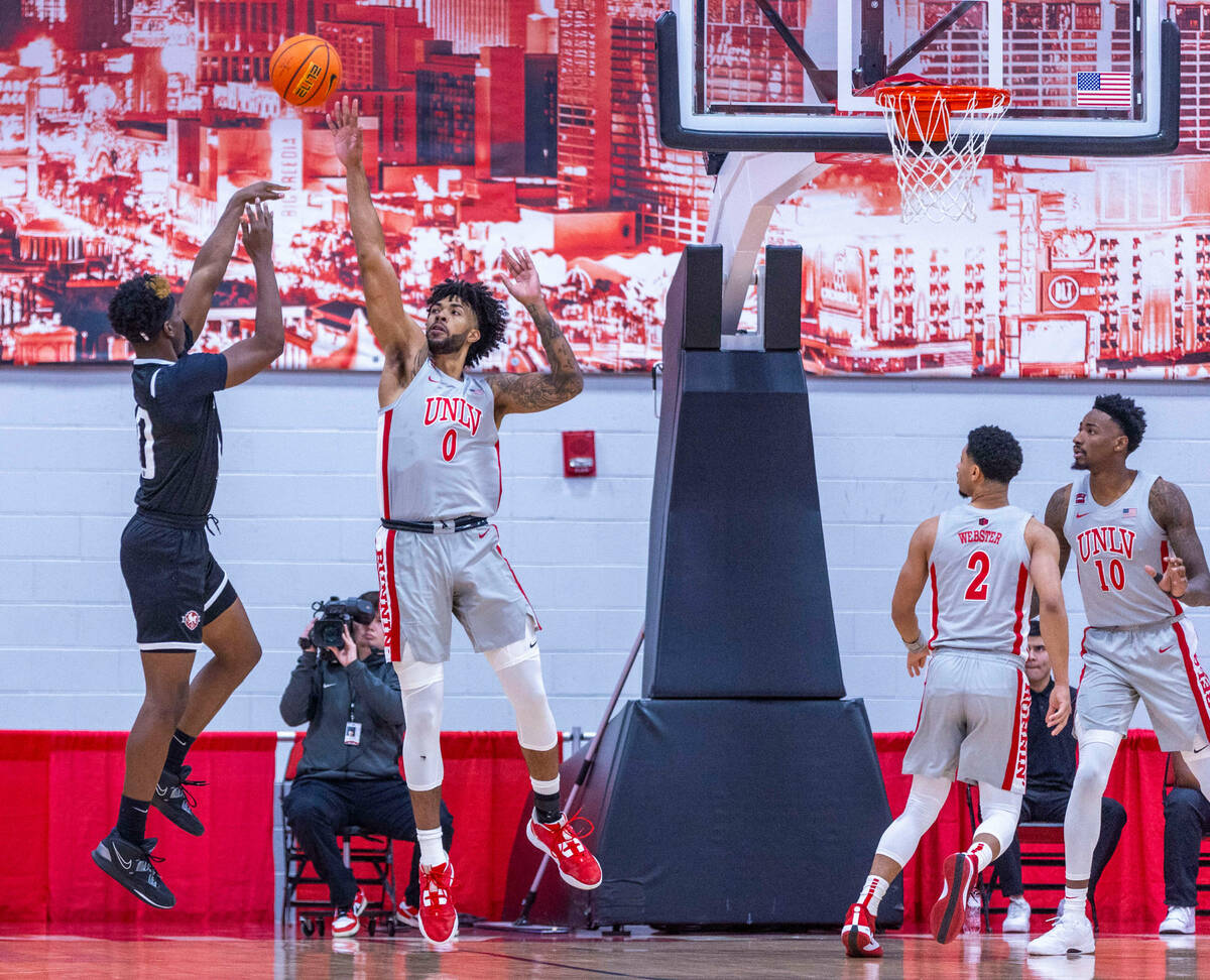 Bethesda University Flames forward Jonathan Ileleji (10) gets a shot tipped by UNLV Rebels forw ...