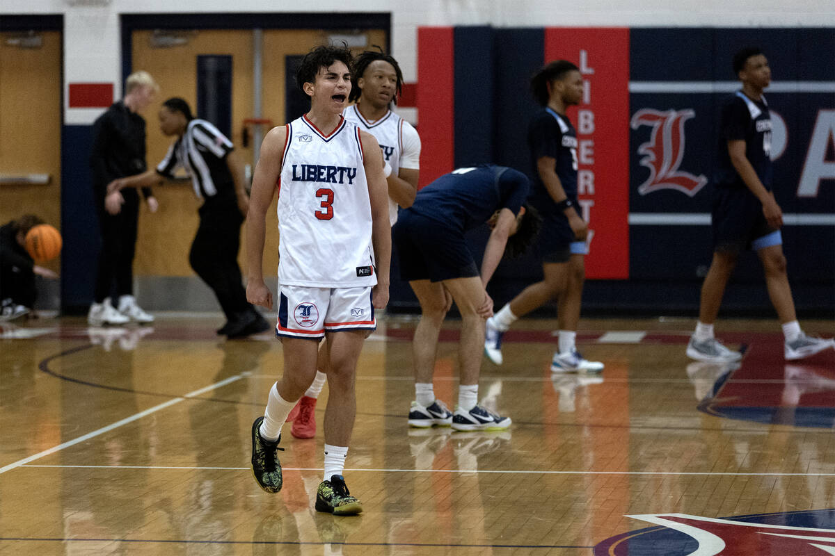 Liberty guard Kaeden Castillero (3) celebrates as his team wins a boys high school basketball g ...