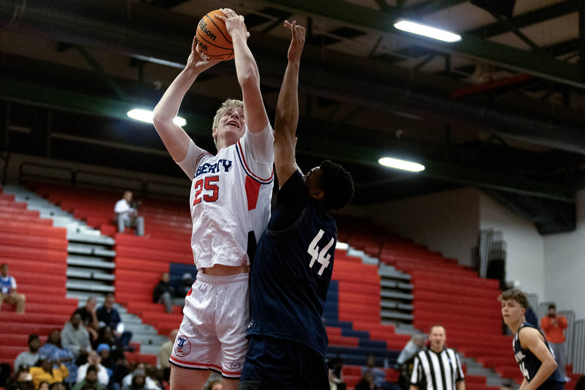 Liberty forward Tyler Bright (25) shoots against Centennial forward Bryce Iwuoha (44) during th ...