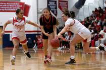 Coronado’s Gabrielle Brooks (11) dribbles through Liberty’s Alofa Eteuini (10) an ...