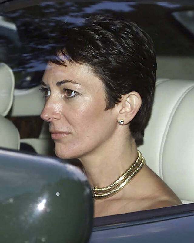 FILE - In this Sept. 2, 2000 file photo, British socialite Ghislaine Maxwell, driven by Britain ...