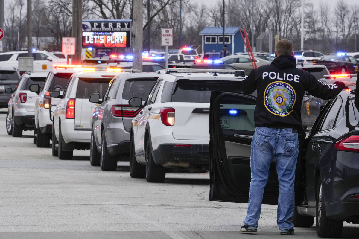 Police respond to Perry High School in Perry, Iowa., Thursday, Jan. 4, 2024. Police say there h ...