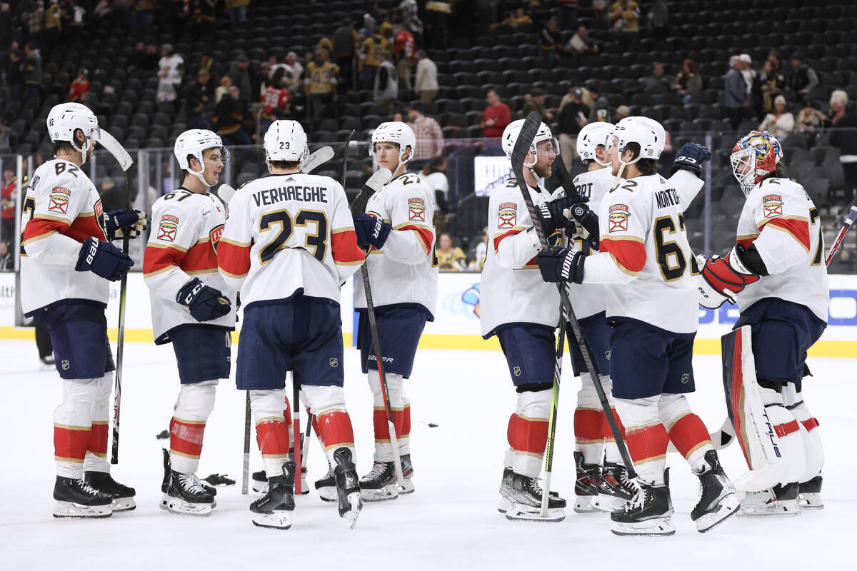 The Florida Panthers celebrate after defeating the Vegas Golden Knights during an NHL game Thur ...