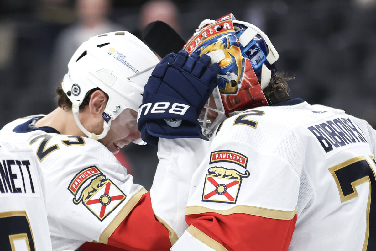 Florida Panthers center Carter Verhaeghe (23) congratulates Florida Panthers goaltender Sergei ...