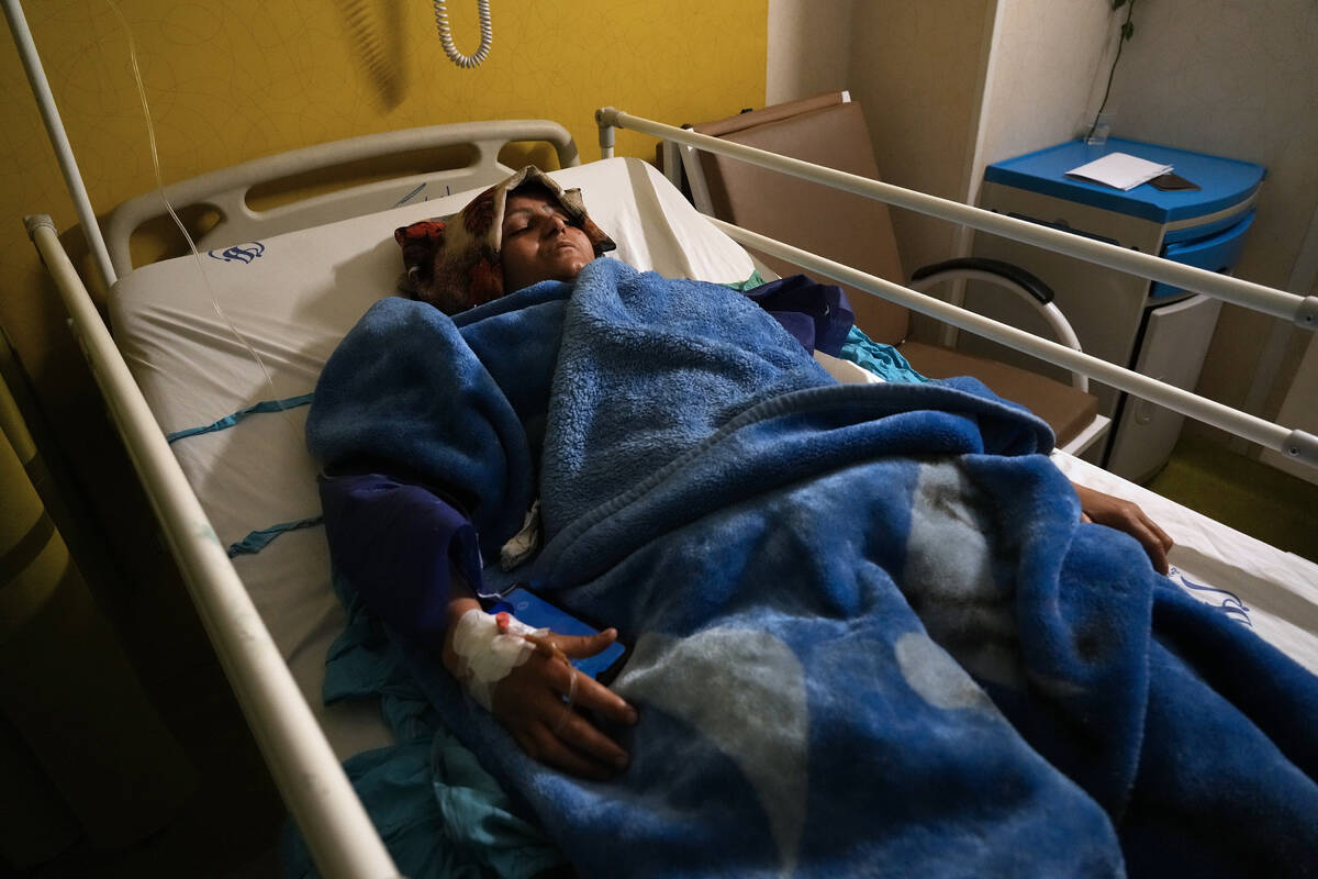 Mahdieh Sazmand who was wounded in Wednesday's bomb explosion lies on bed at Bahonar hospital i ...