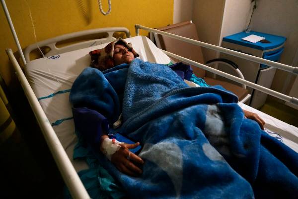 Mahdieh Sazmand who was wounded in Wednesday's bomb explosion lies on bed at Bahonar hospital i ...