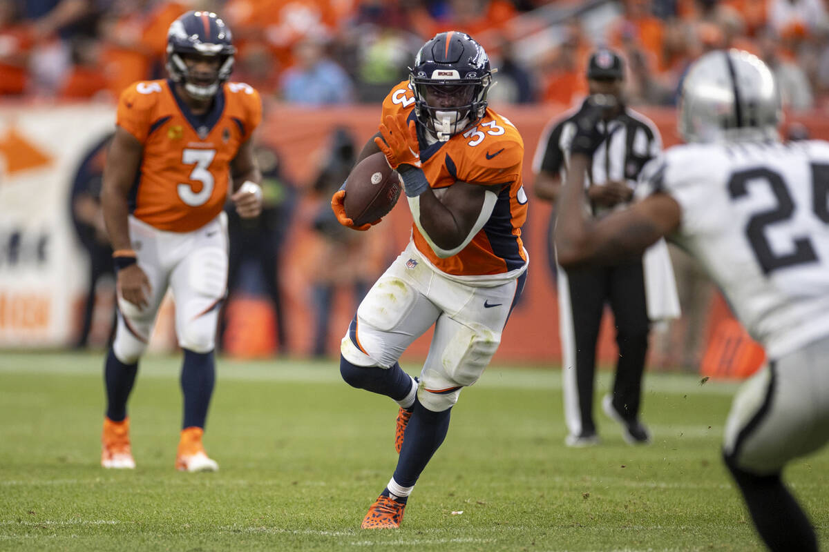 Denver Broncos running back Javonte Williams (33) rushes against the Raiders during the second ...