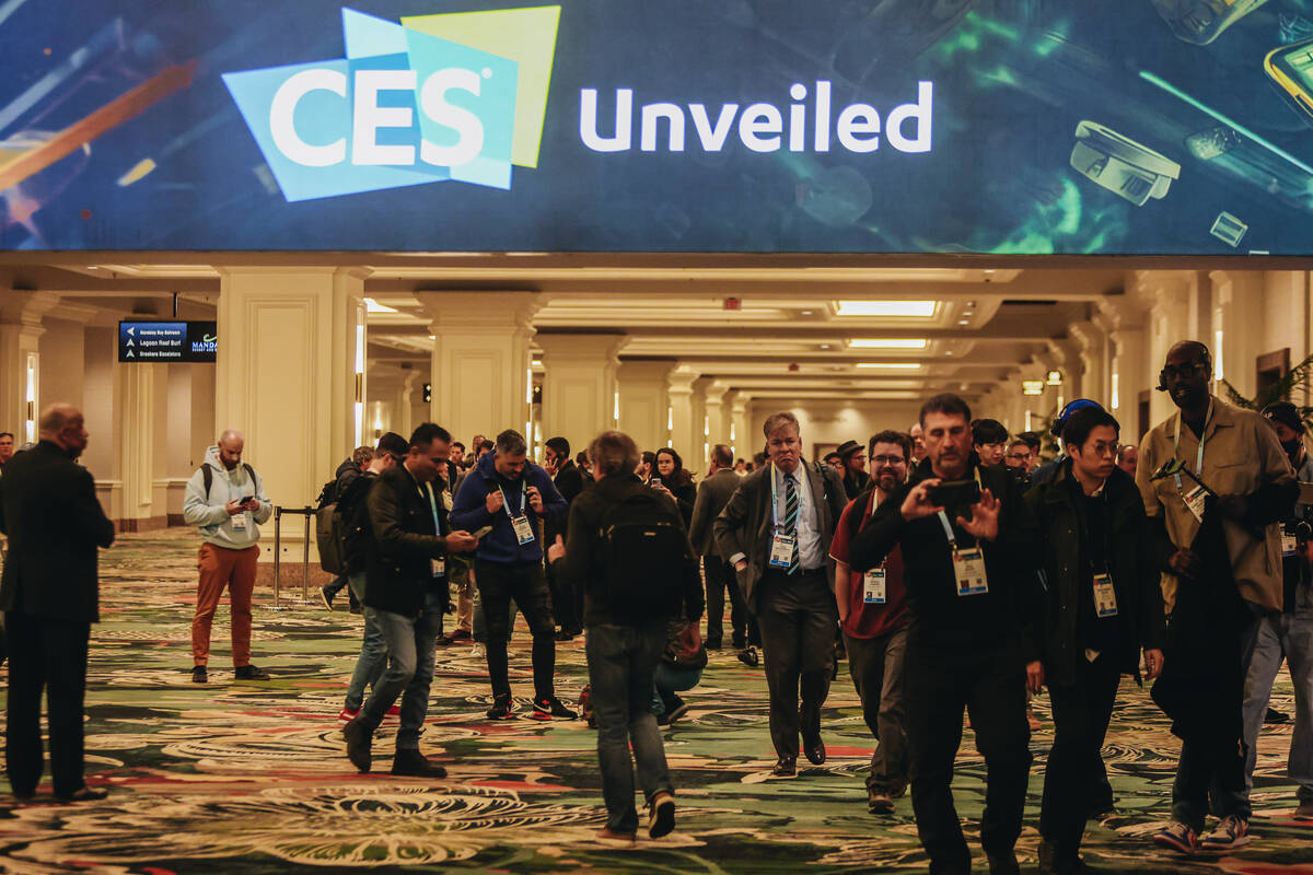 CES attendees walk into the CES Unveiled event at the Mandalay Bay Convention Center on Sunday, ...