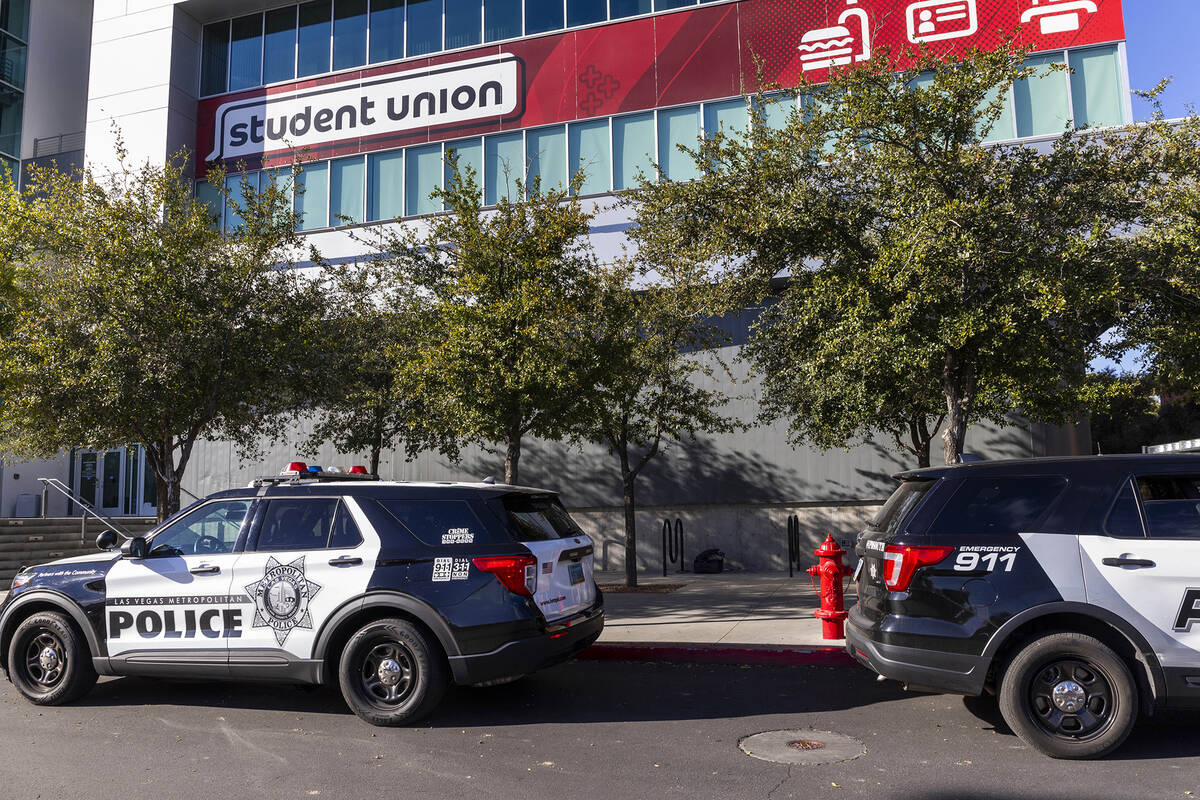 Metro vehicles still line the parking lot outside for the Student Union following the shooting ...