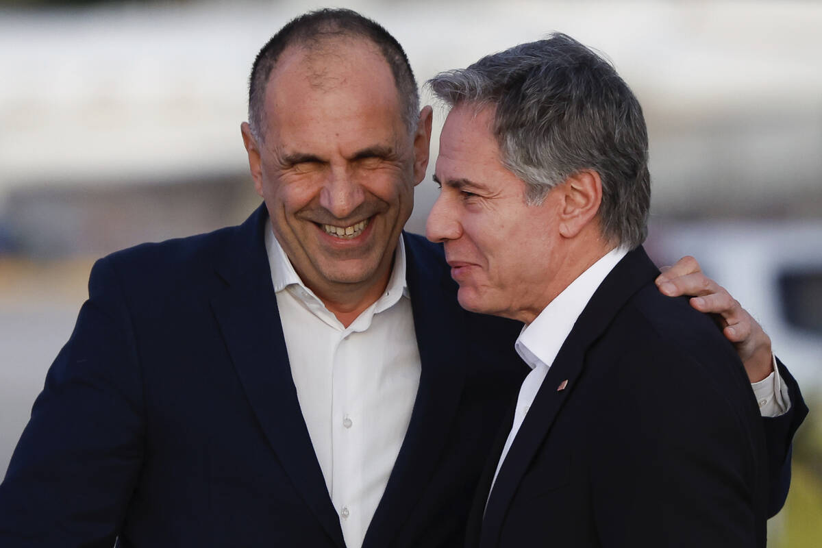 Greek Foreign Minister George Gerapetritis, left, greets U.S. Secretary of State Antony Blinken ...