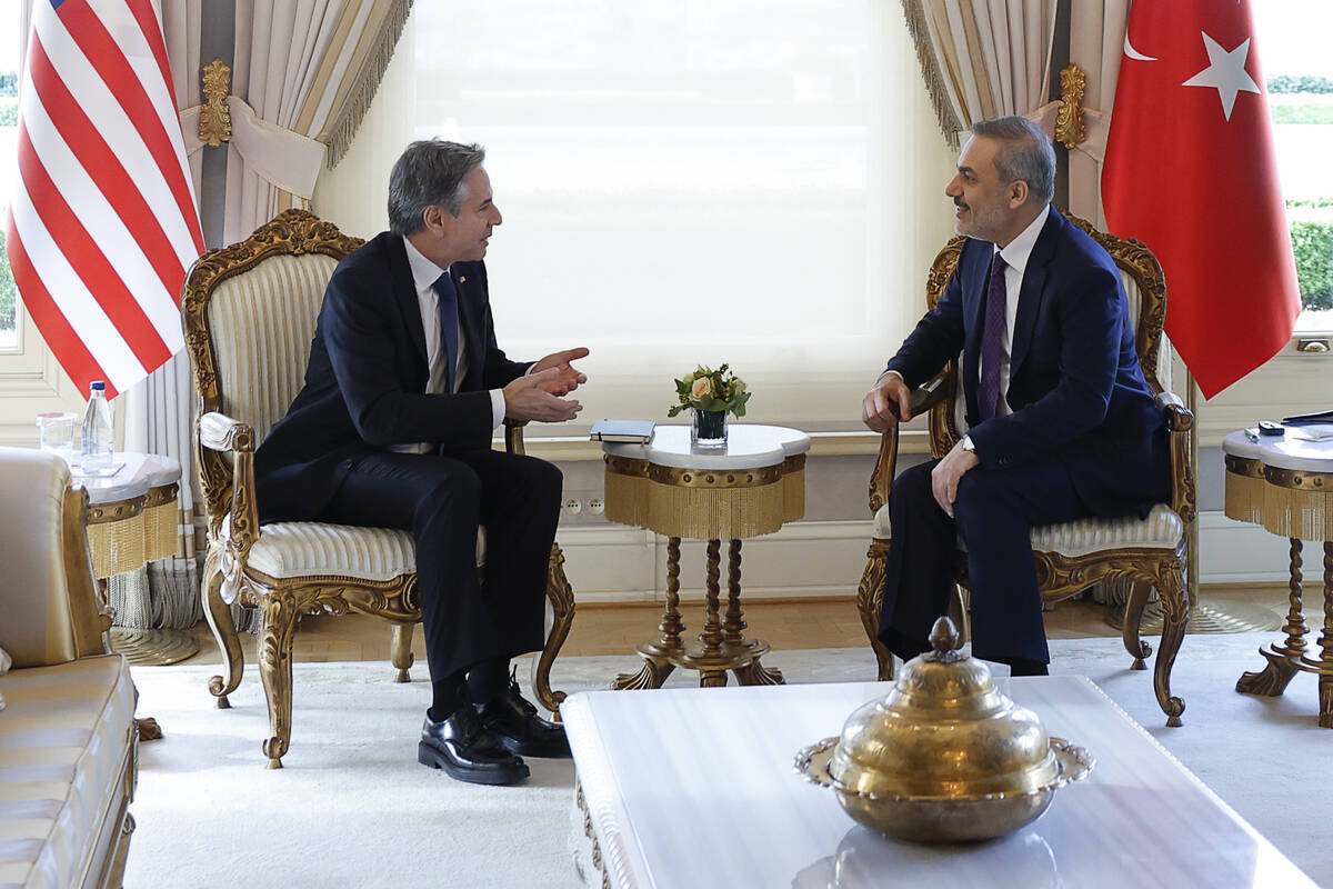 U.S. Secretary of State Antony Blinken, left, meets with Turkish Foreign Minister Hakan Fidan a ...