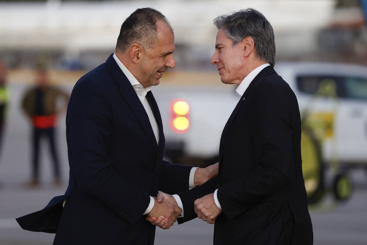 Greek Foreign Minister George Gerapetritis, left, greets U.S. Secretary of State Antony Blinken ...