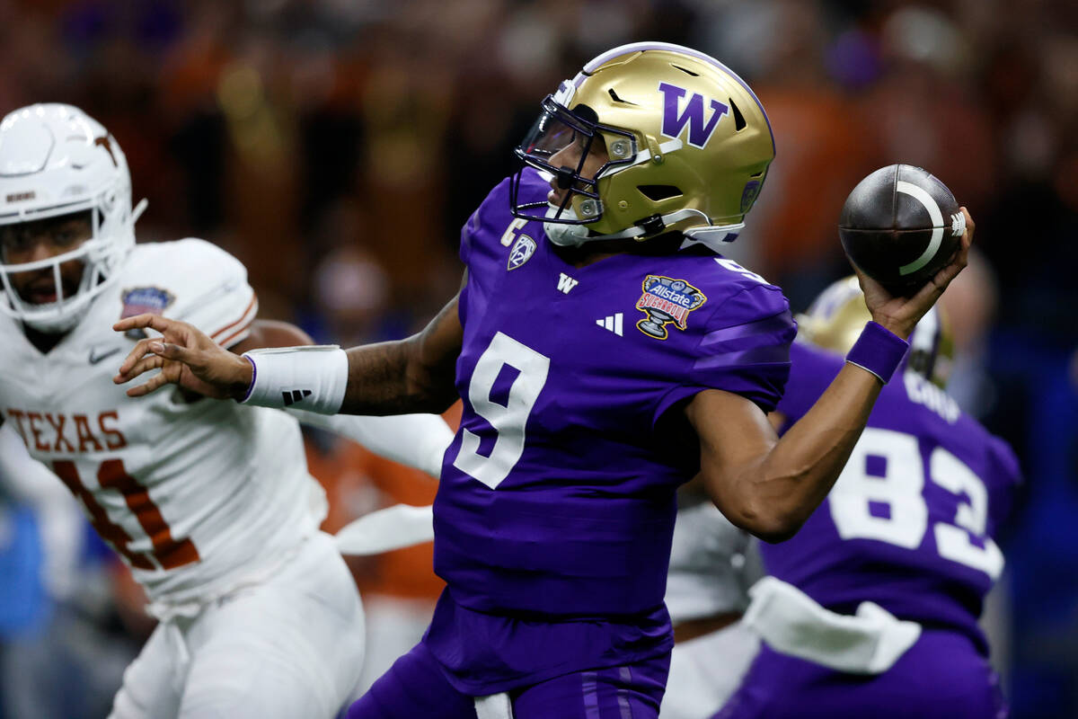 Washington quarterback Michael Penix Jr. throws a pass during the first half of an NCAA college ...