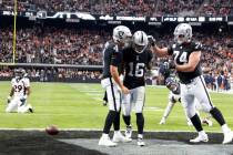 Raiders wide receiver Jakobi Meyers (16) celebrates his touchdown with his teammates quarterbac ...