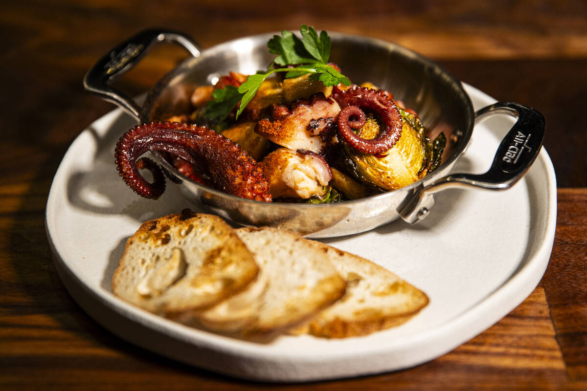 Flambéed octopus is pictured at Casa de Raku, a tapas bar, on Tuesday, Jan. 9, 2024, in La ...