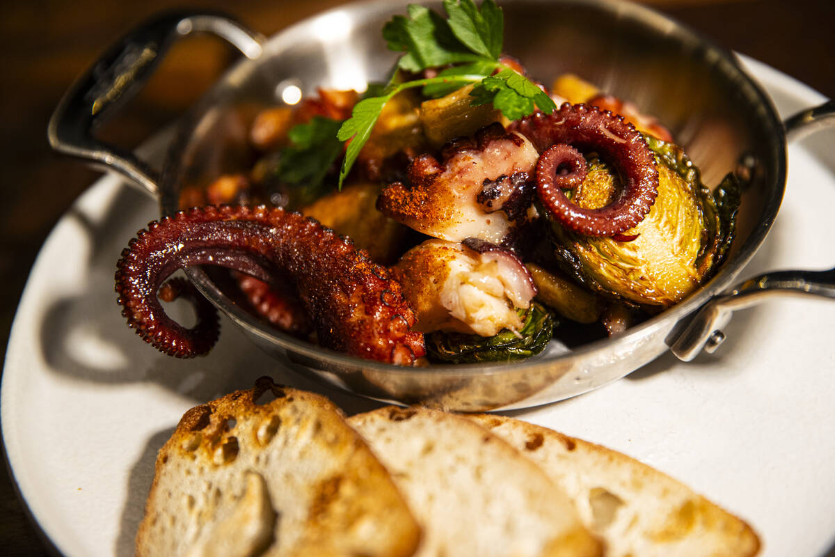 Flambéed octopus is pictured at Casa de Raku, a tapas bar, on Tuesday, Jan. 9, 2024, in La ...