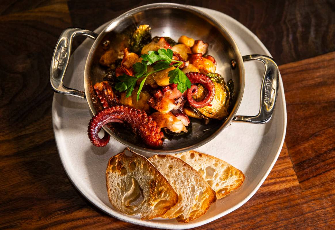 Flambéed octopus is pictured at Casa de Raku, a tapas bar, on Tuesday, Jan. 9, 2024, in La ...