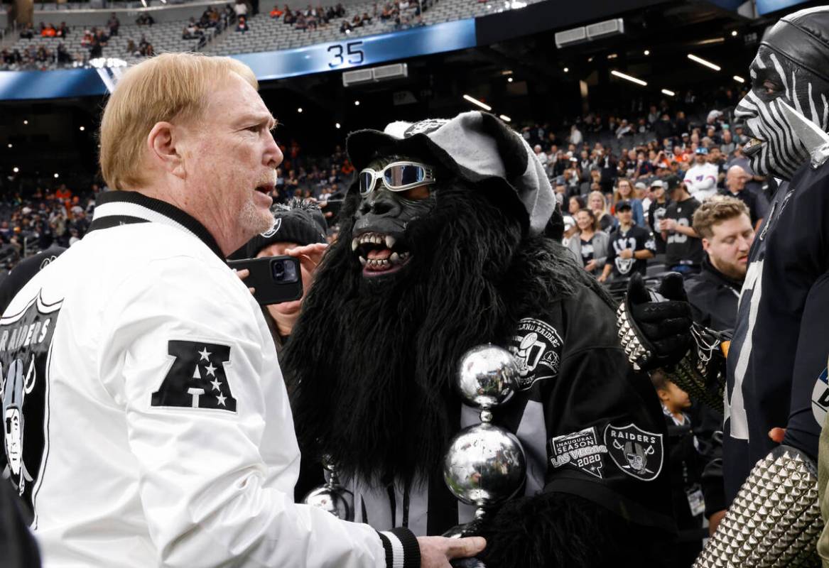 Raiders owner Mark Davis chats with fans prior to the start of an NFL football game between the ...