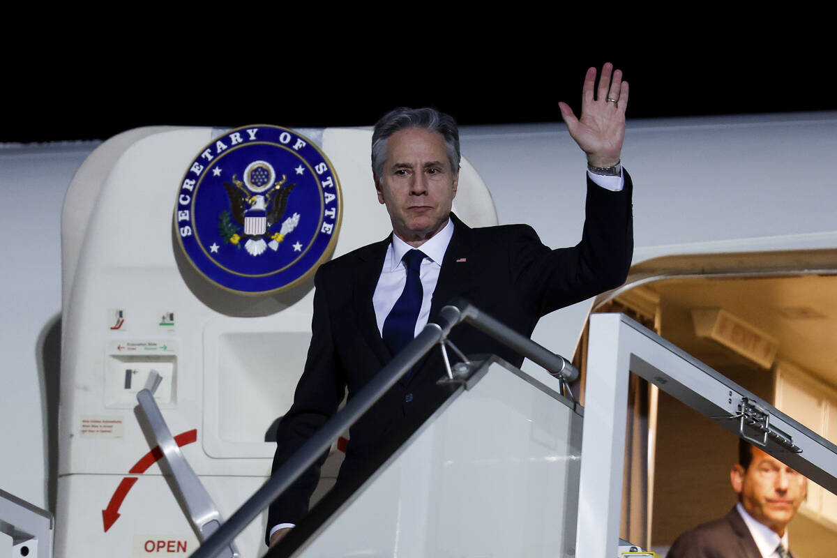 U.S. Secretary of State Antony Blinken looks on as he arrives in Abu Dhabi, during his week-lon ...