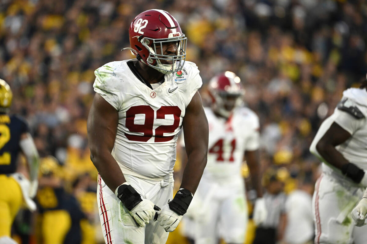 Alabama defensive lineman Justin Eboigbe (92) reacts after tackling Michigan quarterback J.J. M ...