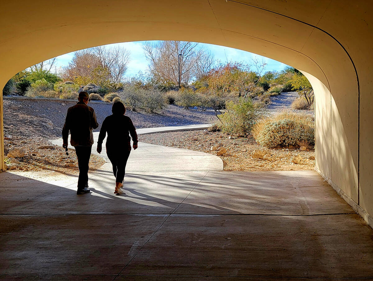 Late December walkers spend part of a sunny afternoon on the winding trails of Cottonwood Canyo ...