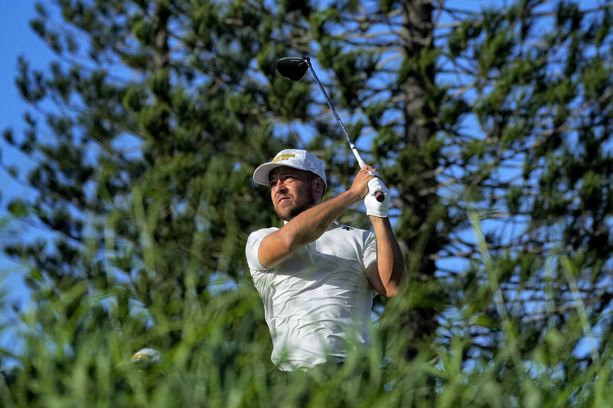Xander Schauffele hits from the third tee during the third round of The Sentry golf event, Satu ...