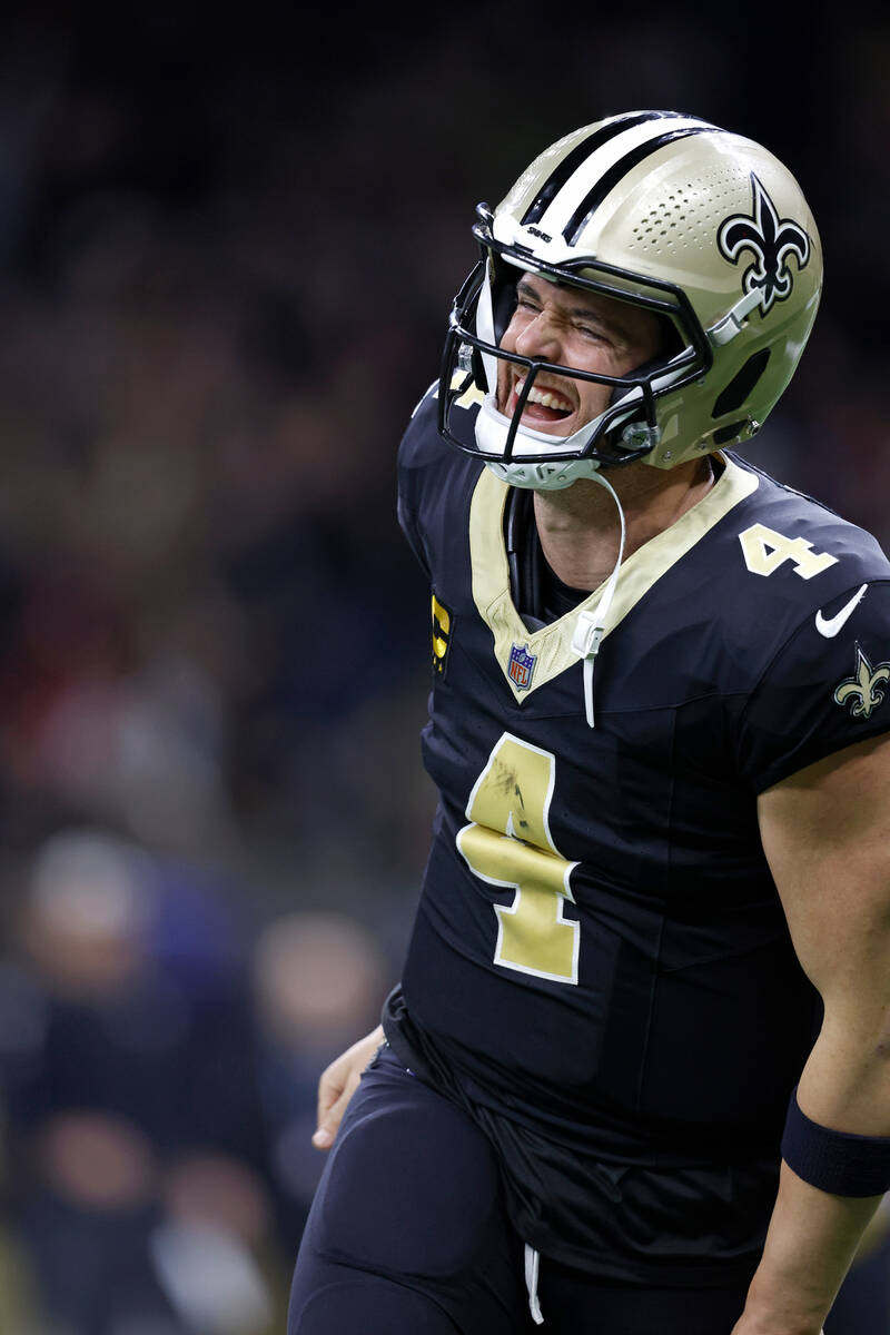 New Orleans Saints quarterback Derek Carr (4) celebrates after a touchdown during an NFL footba ...