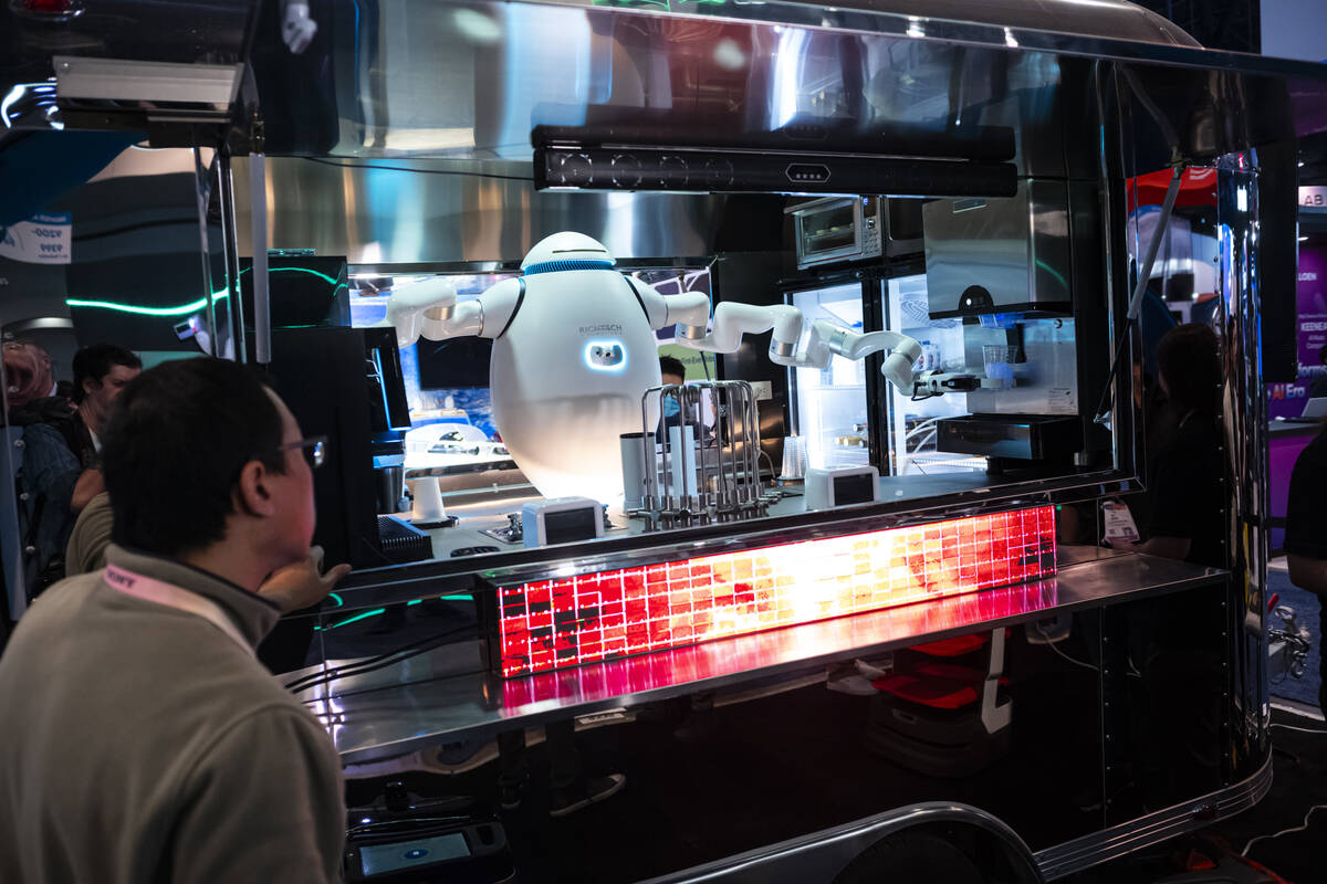 A food service robot from Richtech Robotics prepares coffee during the first day of CES at the ...