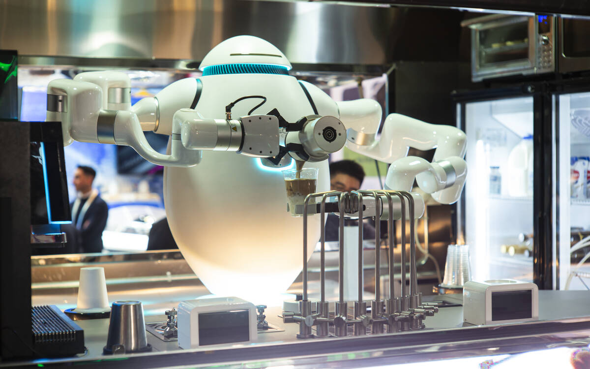 A food service robot from Richtech Robotics prepares coffee during the first day of CES at the ...