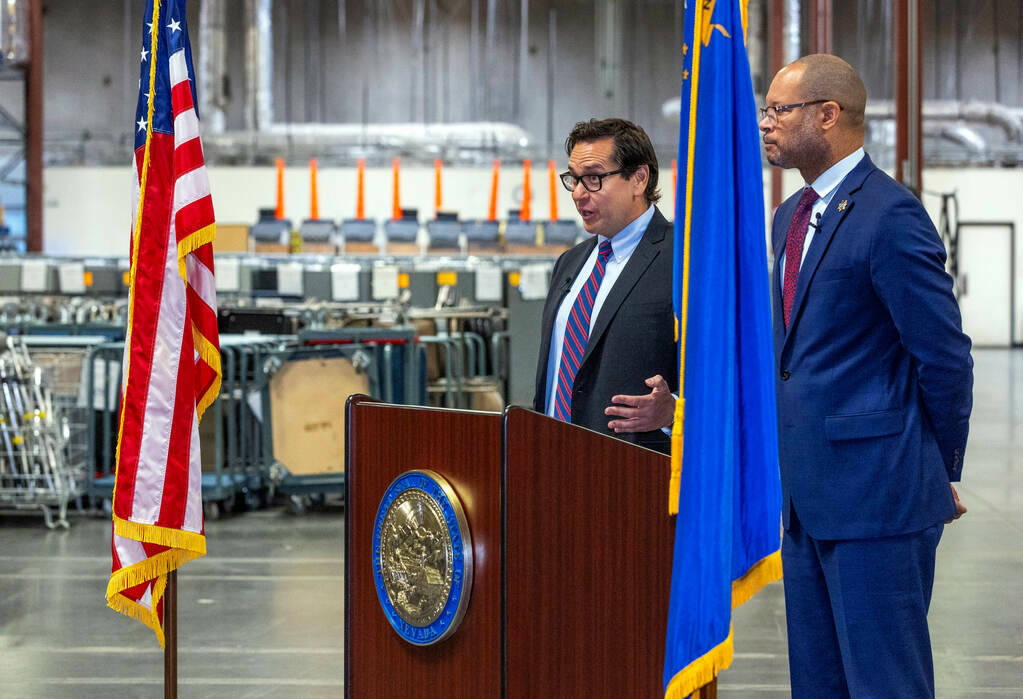 Nevada Secretary of State Francisco Aguilar, left, speaks beside Attorney General Aaron Ford ab ...