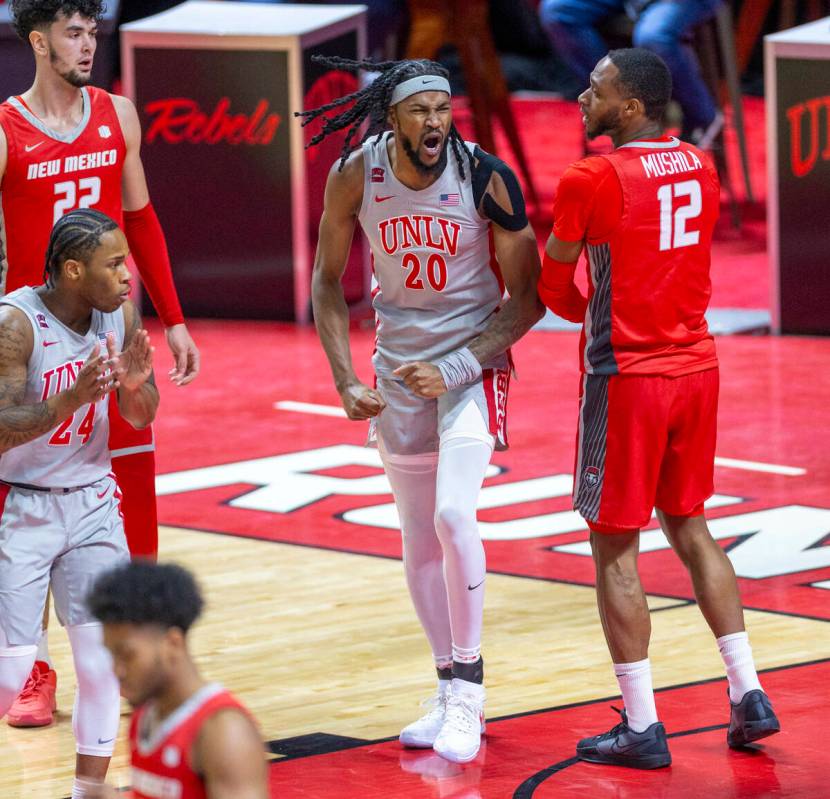 UNLV forward Keylan Boone (20) is pumped up after a turn over by New Mexico Lobos forward Isaac ...