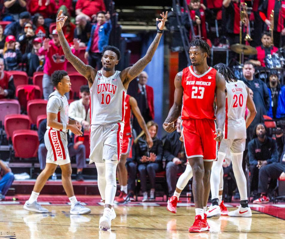 UNLV forward Kalib Boone (10) is pleased with their domination over the New Mexico Lobos during ...