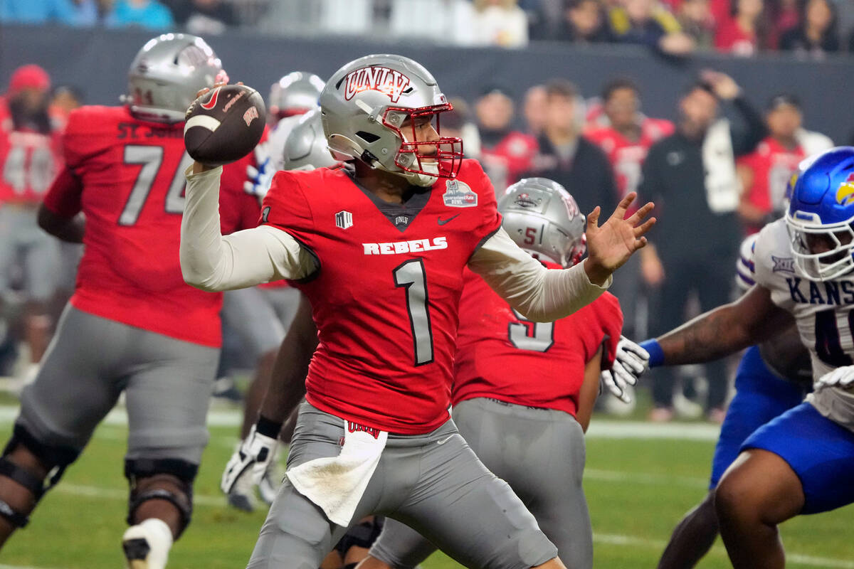 UNLV quarterback Jayden Maiava (1) looks for a receiver during the first half of the team's Gua ...