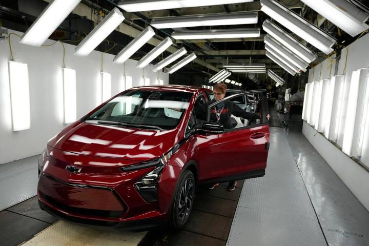 Assembly line worker Janice DeBono looks over a 2023 Chevrolet Bolt EUV at the General Motors O ...