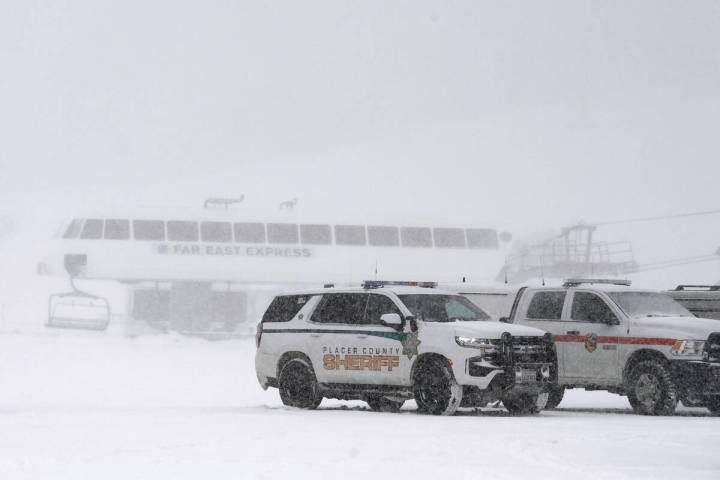 Placer County sheriff vehicles are parked near the ski lift at Palisades Tahoe where avalanche ...