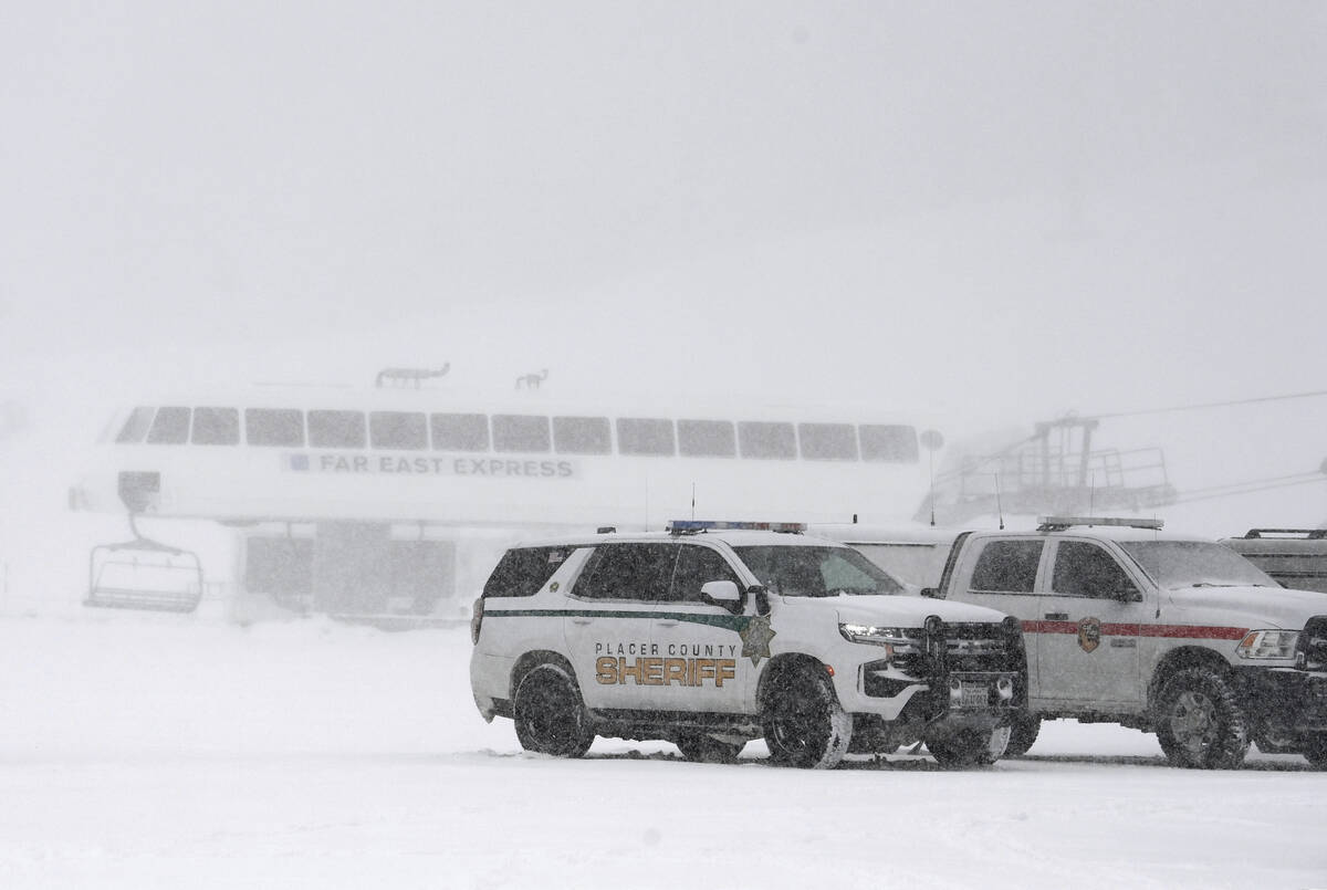 Placer County sheriff vehicles are parked near the ski lift at Palisades Tahoe where avalanche ...