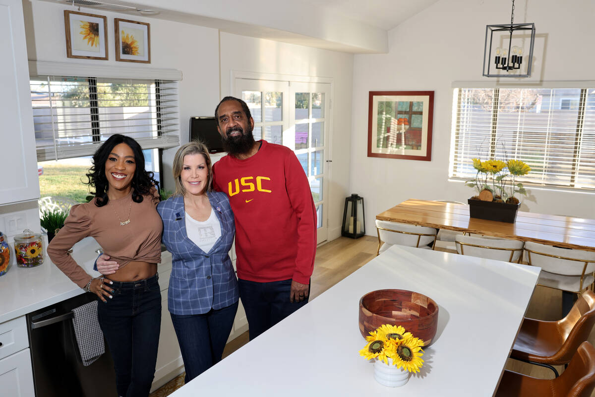 Jasmine Lee, left, and her husband Charles, who moved from California to Las Vegas, pose with t ...