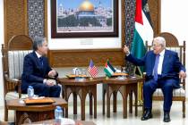 U.S. Secretary of State Antony Blinken, left, meets with Palestinian President Mahmoud Abbas in ...
